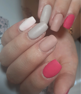 Elegant sculpted almond nails with glazed donut chrome finish and soft pink undertones, holding a luxury perfume bottle, soft studio lighting.